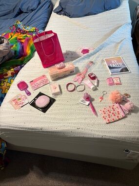 Pink spa bag, soap, masks, jewelry. Keychains, brush, pen, devotional,lotion,lip
